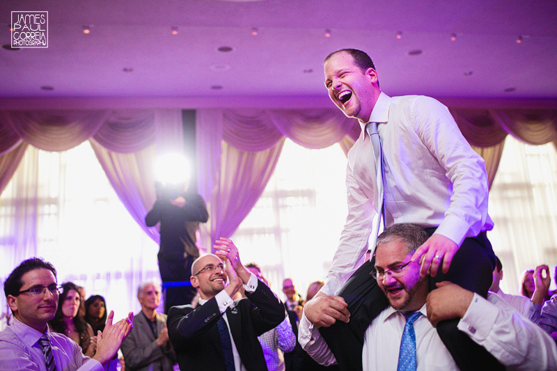 jewish wedding groom on shoulders