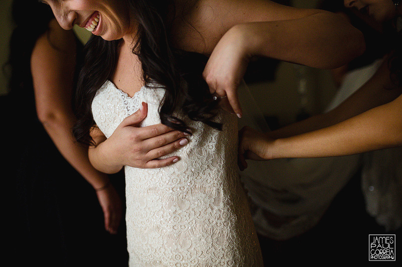 bride putting on dress