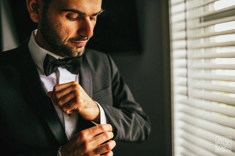 toronto wedding photographer groom getting dressed