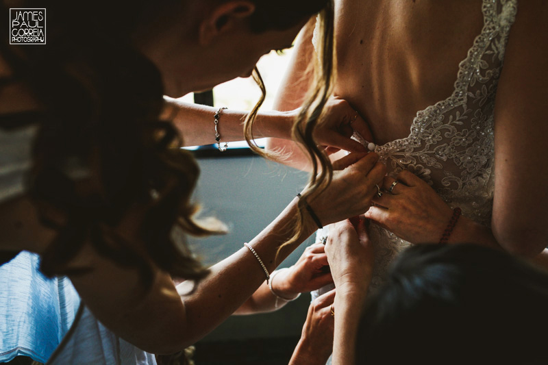 toronto wedding bridesmaids help bride dress