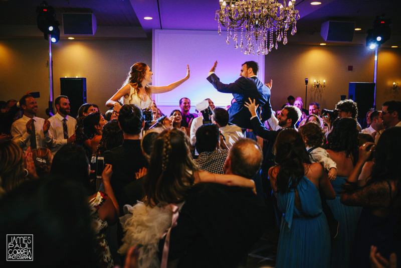 jewish hora toronto wedding photographer up on chairs