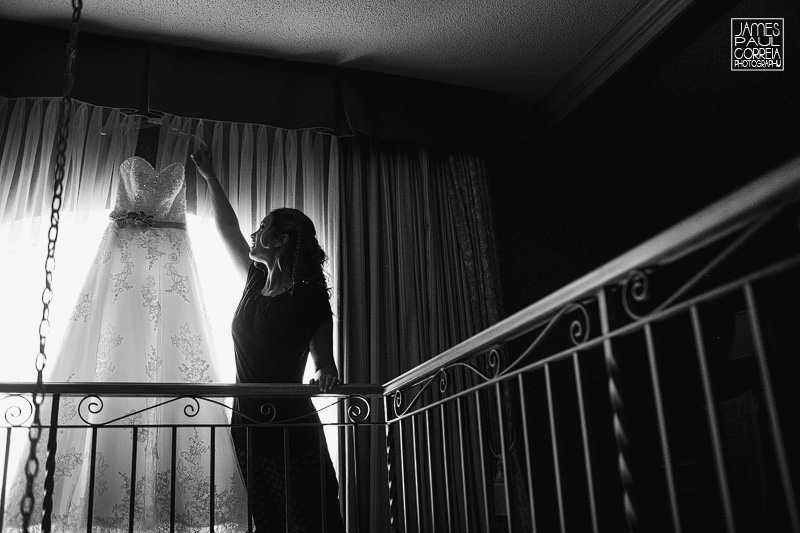 montreal wedding photographer bride grabs dress
