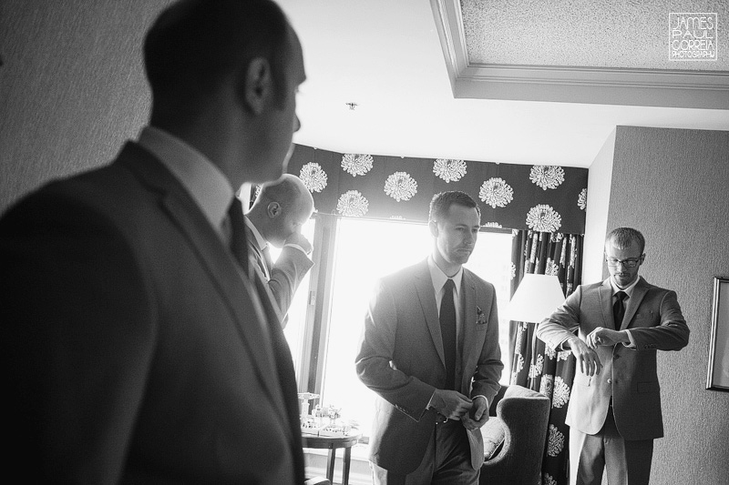 intercontinental hotel wedding photographer groomsmen getting dressed