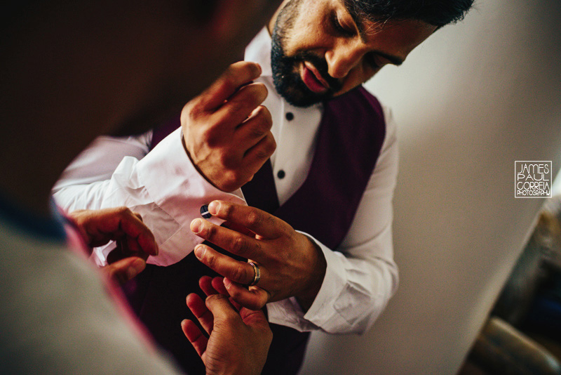 toronto wedding photographer groom getting dressed